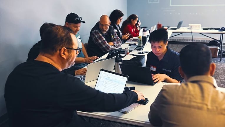 Cloudpermit professional services helping clients at a customer conference
