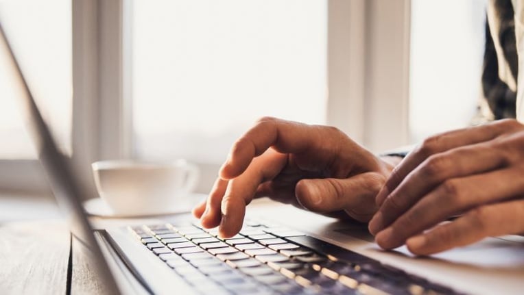 Local government planning reviewing on site plan on a laptop