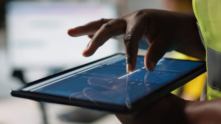 Public works inspector accessing data in real-time in the field