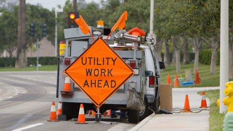 Utility workers completing a work order request